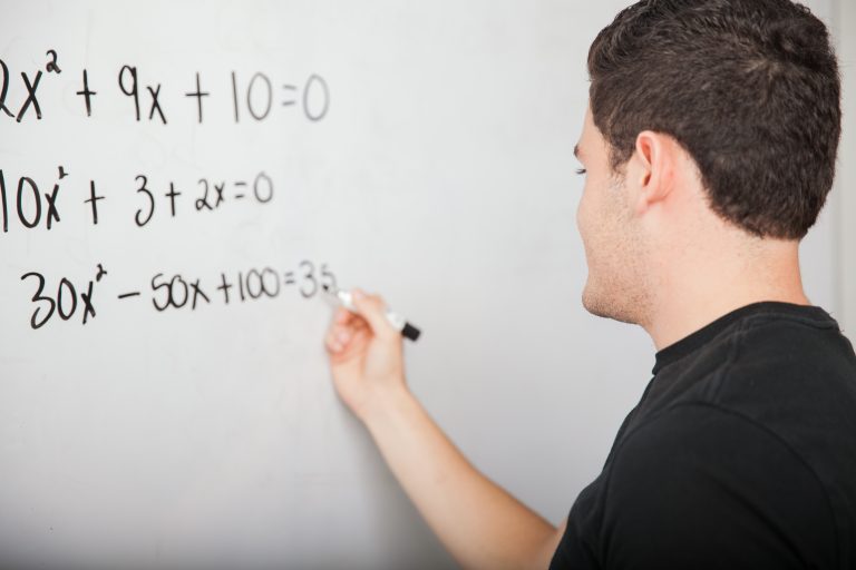 High,School,Student,Writing,A,Few,Math,Equations,On,A
