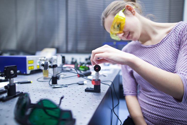 Female,Scientist,Doing,Research,In,A,Quantum,Optics,Lab,(color